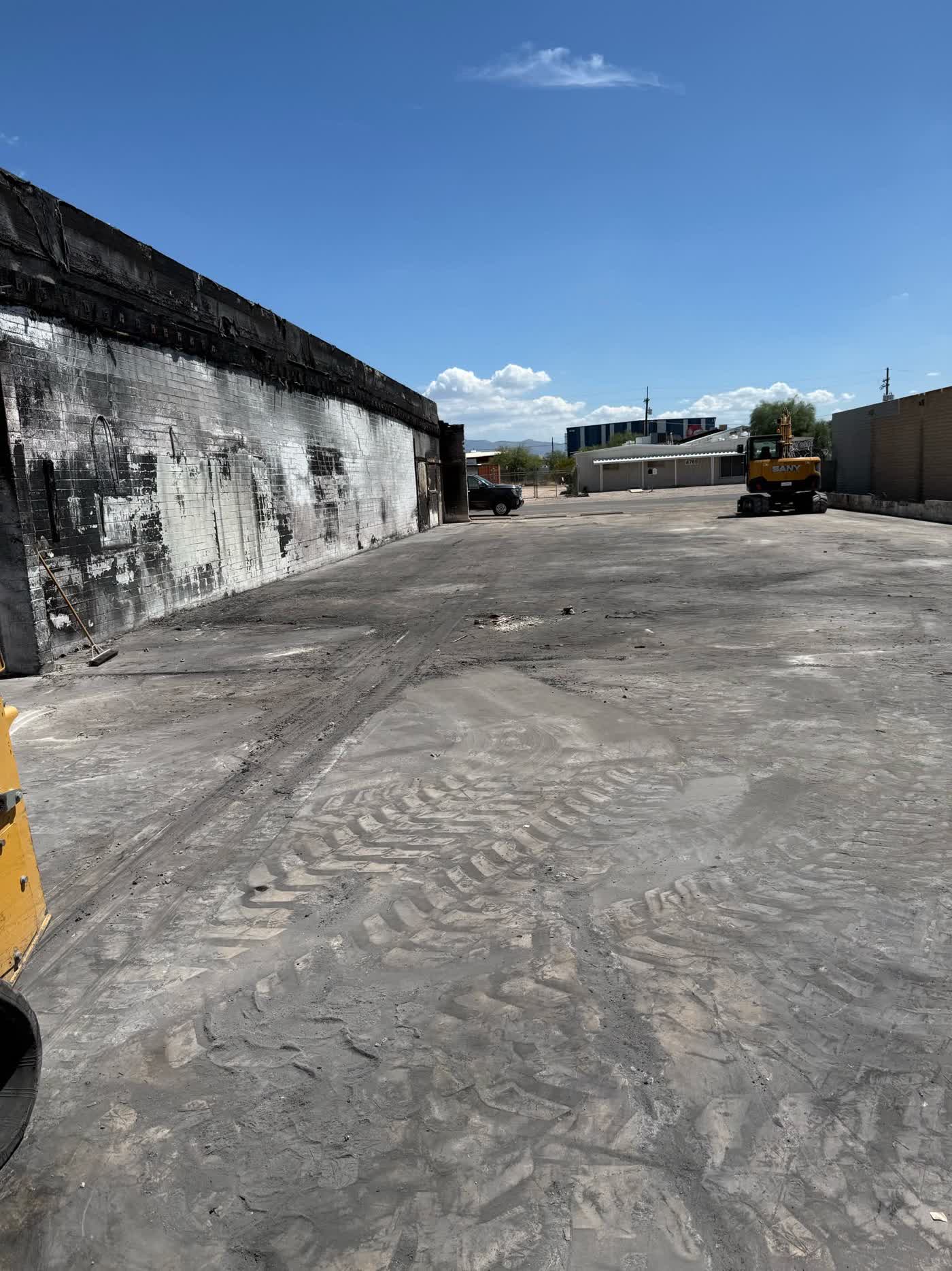 Fire-damaged structure cleared to an open working surface