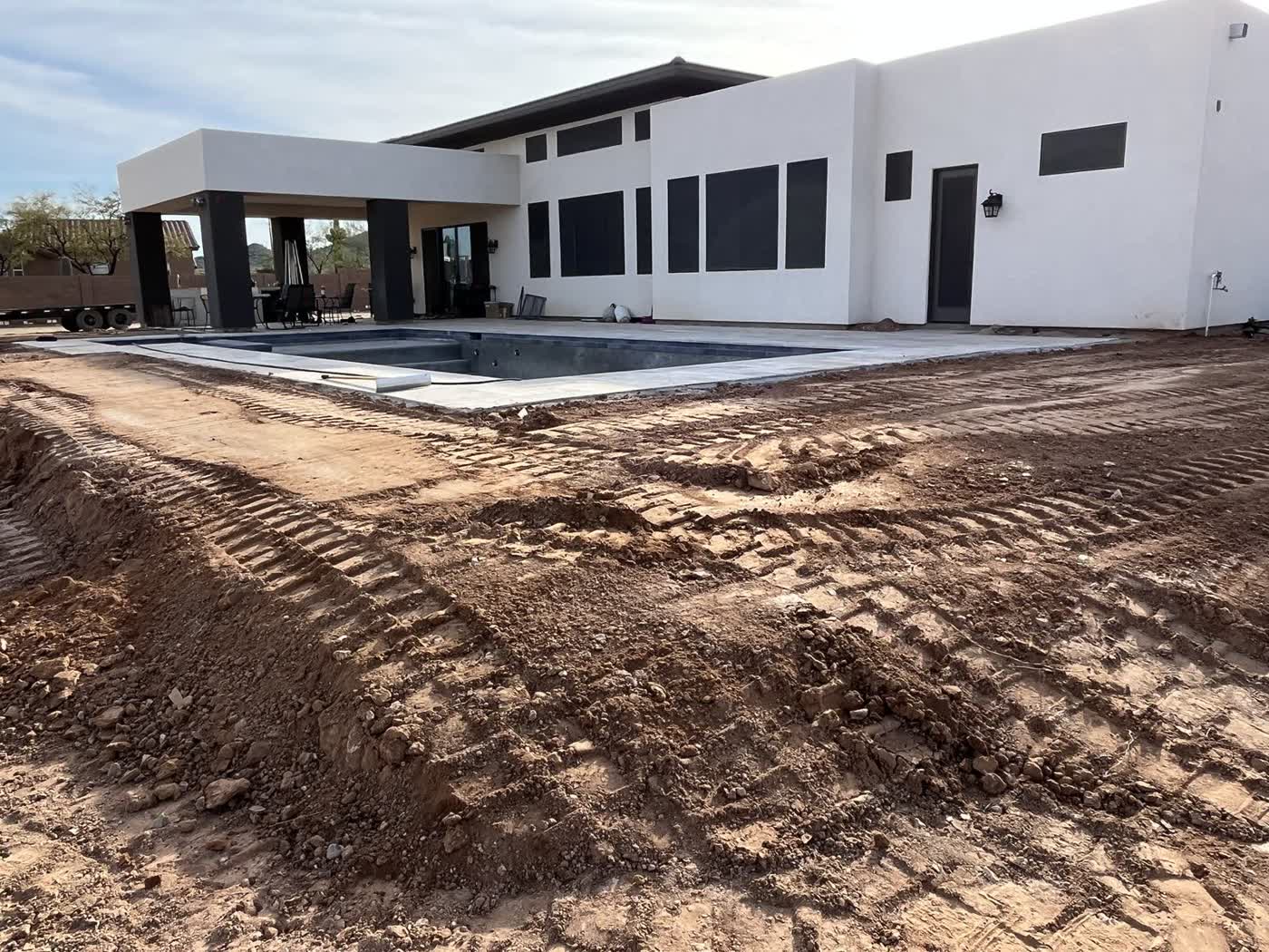 Backyard grade prepared around a pool shell