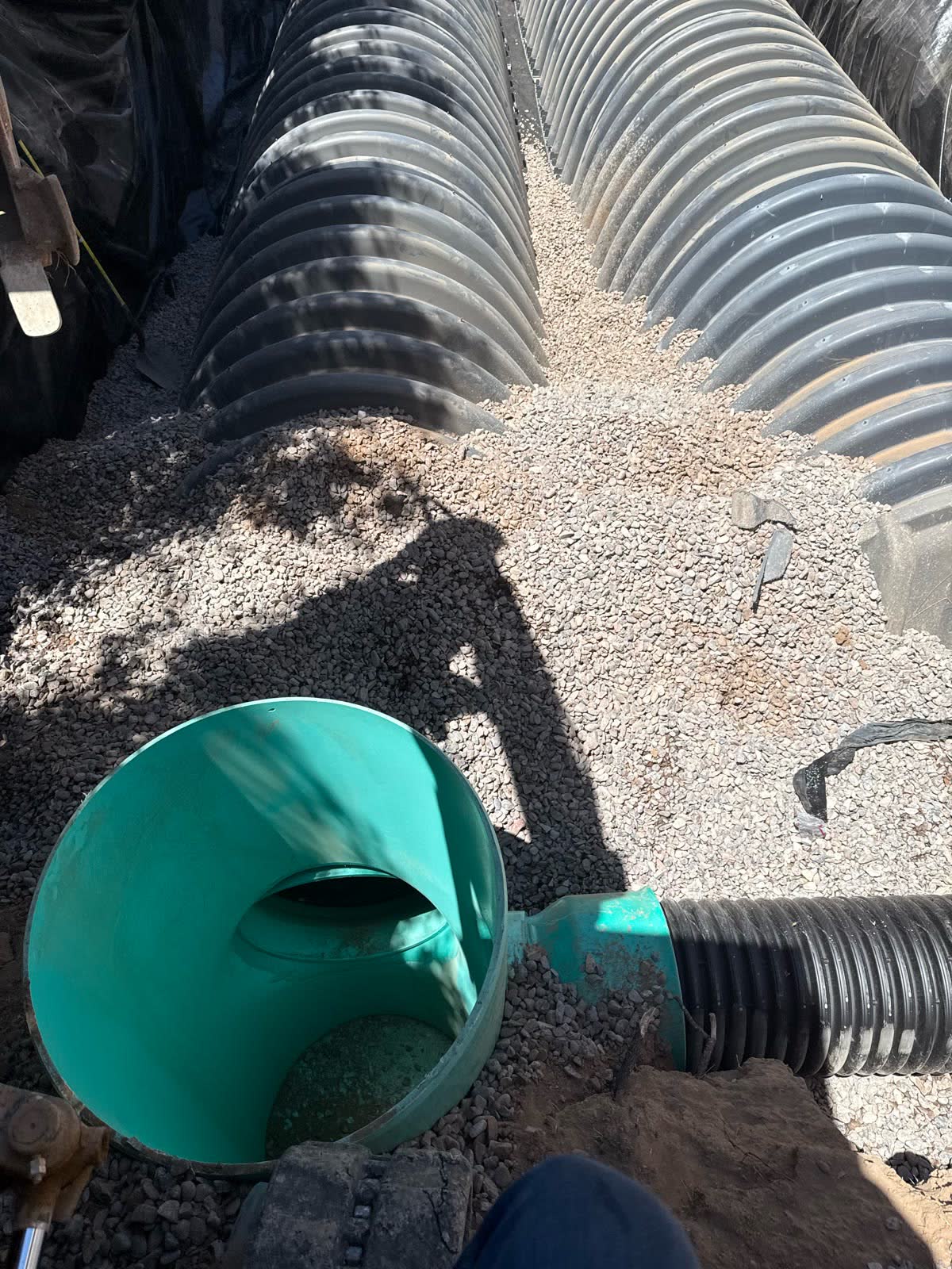 Corrugated septic chambers over a gravel bed