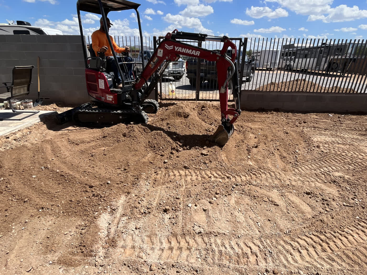 Compact Yanmar excavator on a site prep job